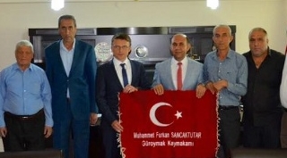 Şehit ailelerinden kaymakam Sancaktutar’a hayırlı olsun ziyareti